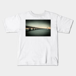 In the colorful evening light lies the Öresund Bridge, which connects Sweden and Denmark Kids T-Shirt